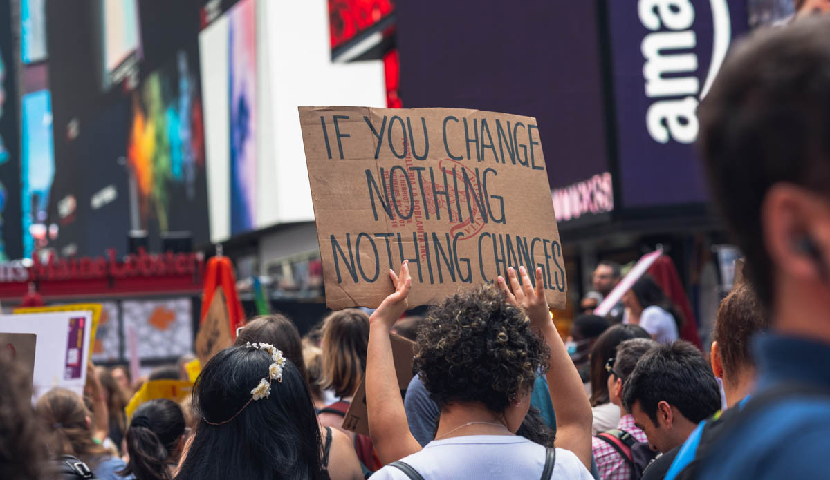 Time Square, New York City. Nonviolent Protesters. Young People Gathered For A Protest Against Global Warming.