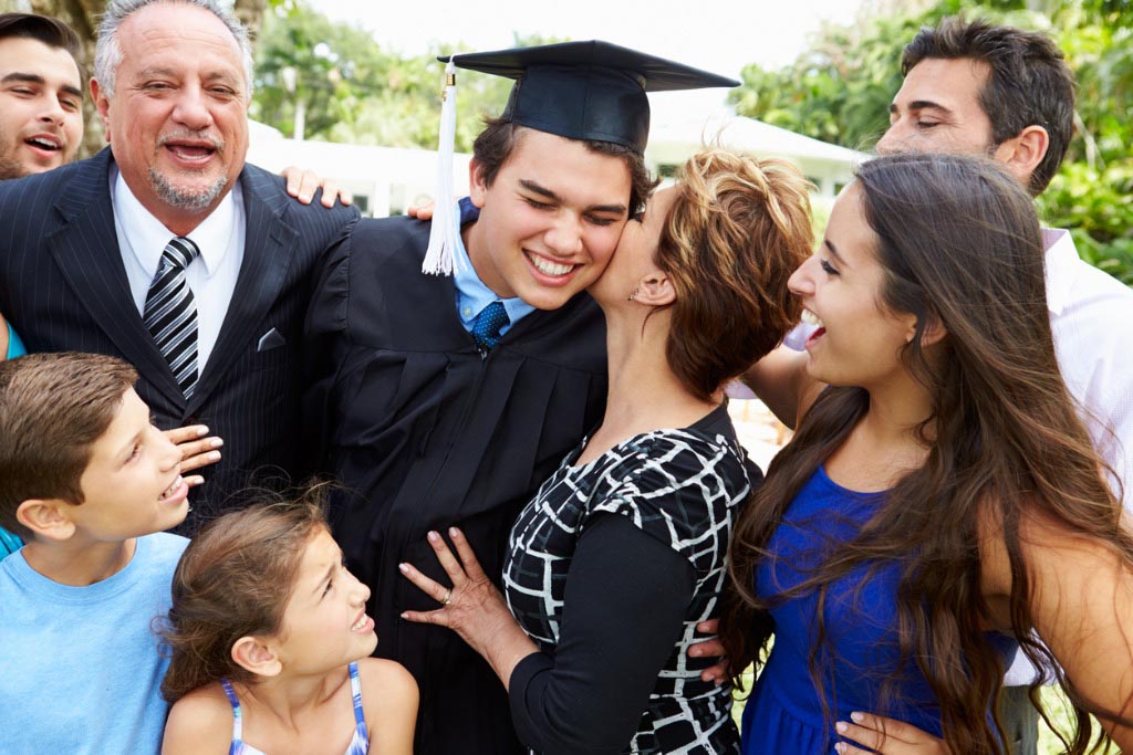 hispanic student and family celebrating graduation picture id496647399