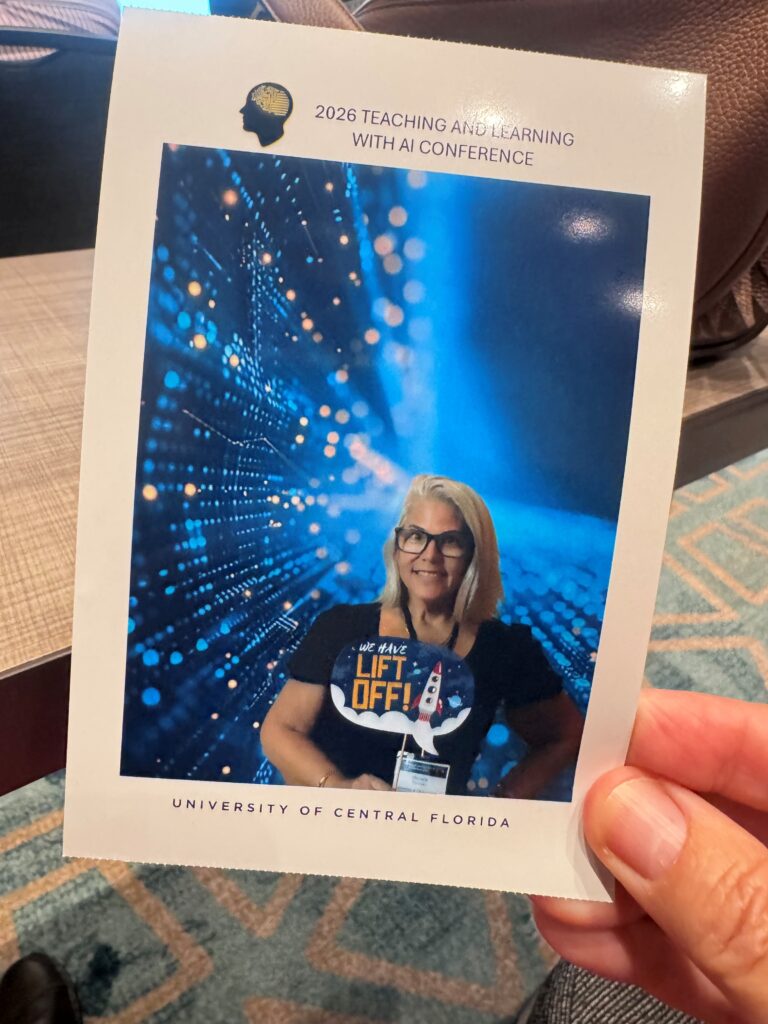 Michelle Dusseau standing in front of a digital-themed backdrop while interacting with a photo activation at UCF’s Teaching and Learning with AI Conference.